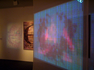 installation view: transistors and DVoice (video on scrim)
